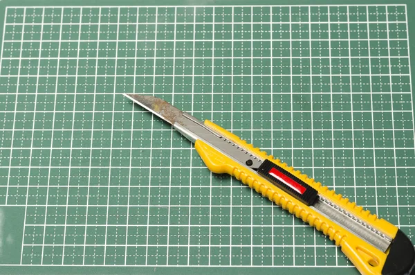 Cutter knife on cutting board