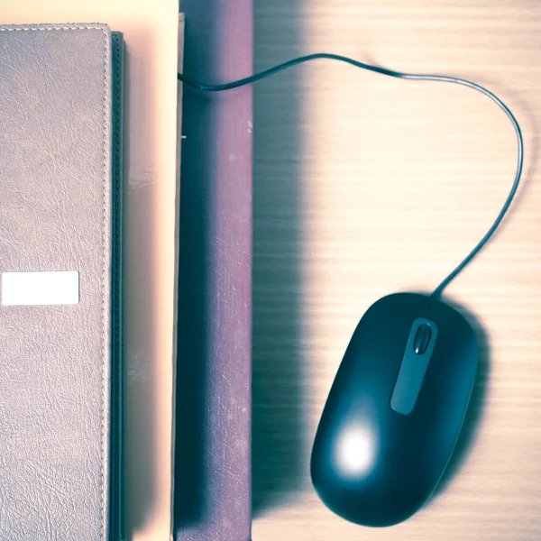 Book and computer mouse