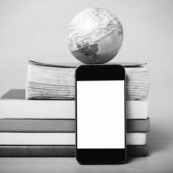 Book and earth ball with smart phone black and white color tone