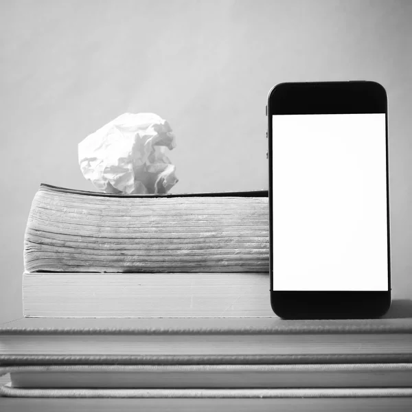 Stack of book and smart phone black and white color tone style