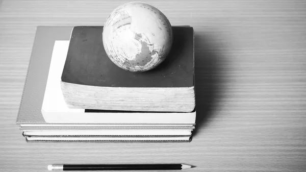 Book and earth ball with black pencil black and white color tone