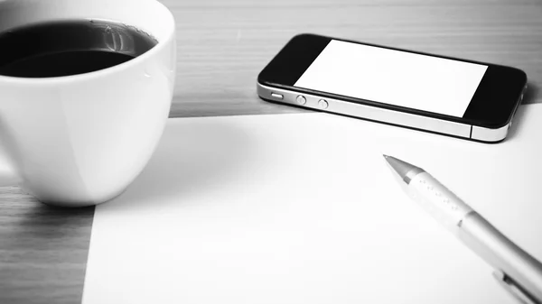 Paper and pen with coffee cup and smart phone black and white co