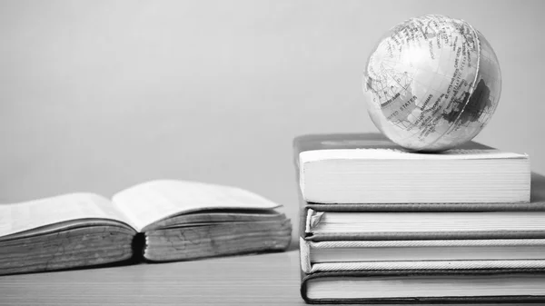 Book and earth ball black and white color tone style