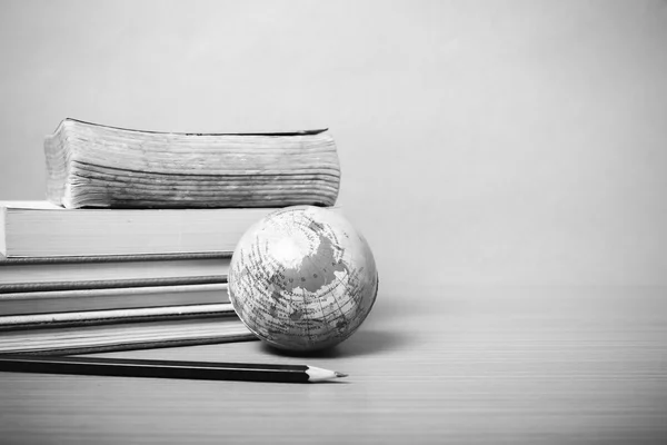 Book and earth ball with black pencil black and white color tone