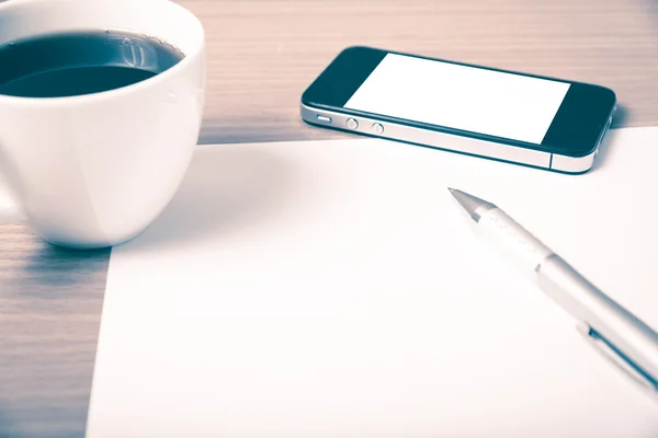 Coffee cup and smartphone