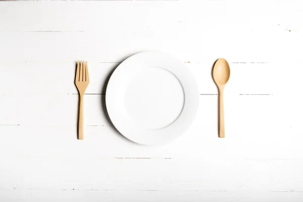 Wood spoon and fork with dish