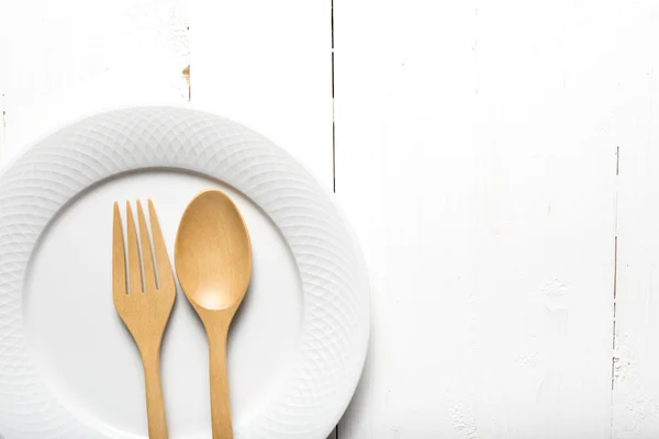 Wood spoon and fork with dish
