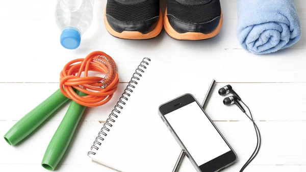 Fitness equipment on white wood table