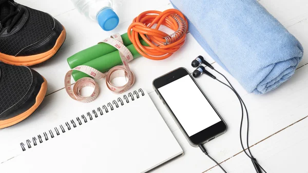 Fitness equipment on white wood table