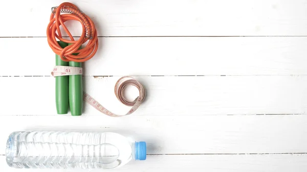 Fitness equipment on white wood table