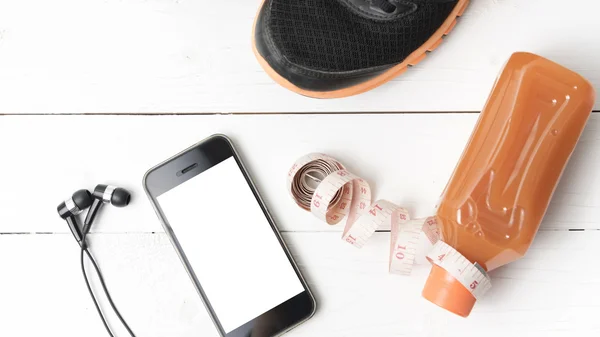 Running shoes,orange juice,measuring tape and phone