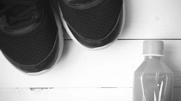 Running shoes and orange juice black and white tone color style