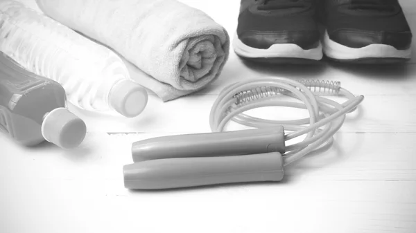 Fitness equipment on white wood background black and white tone