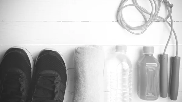 Fitness equipment on white wood background black and white tone