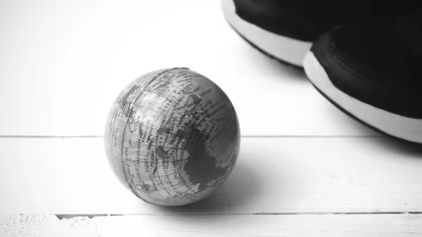 Running shoes and earth ball black and white tone color style