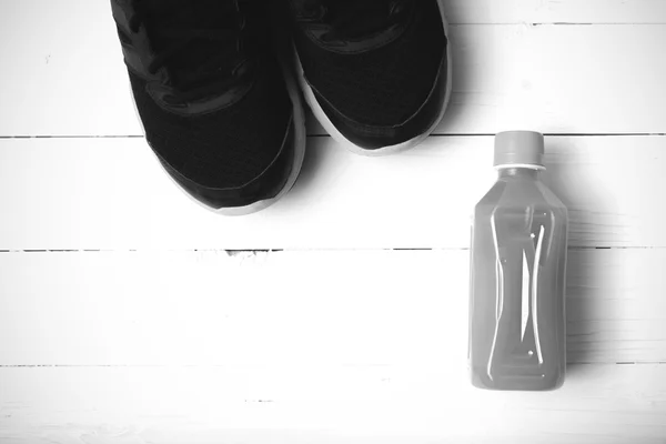 Running shoes and orange juice black and white tone color style