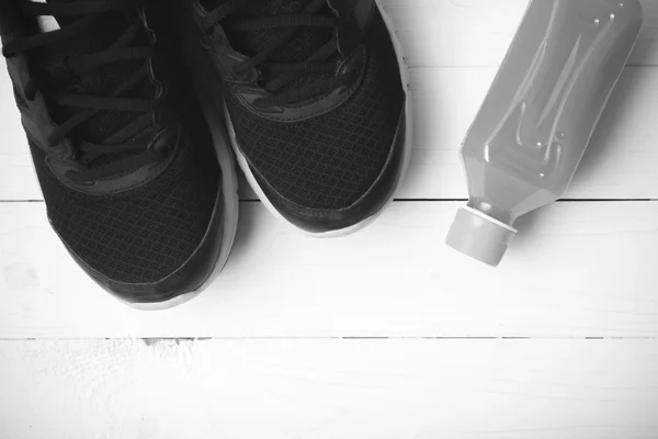 Running shoes and orange juice black and white tone color style