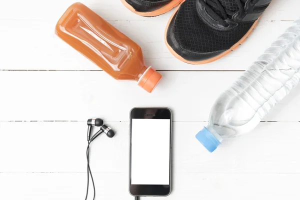 Running shoes,orange juice,drinking water and phone