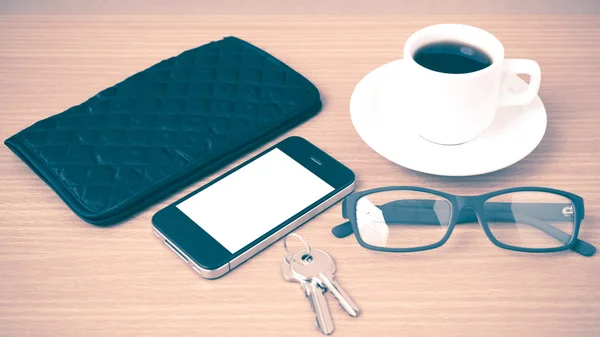 Coffee,phone,key,eyeglasses and wallet