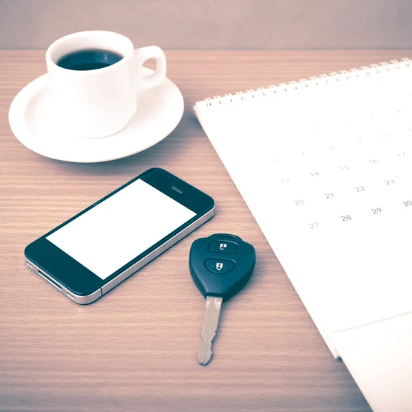 Coffee,phone,car key and calendar