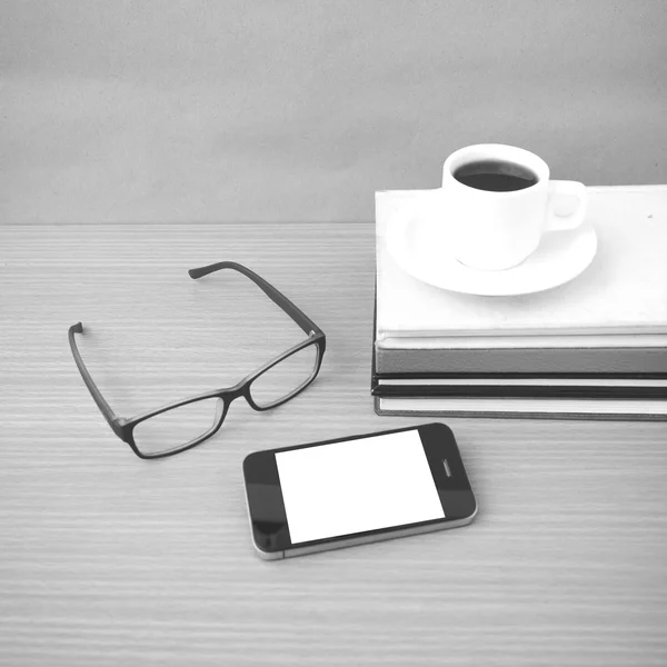 Coffee,phone,stack of book and eyeglasses