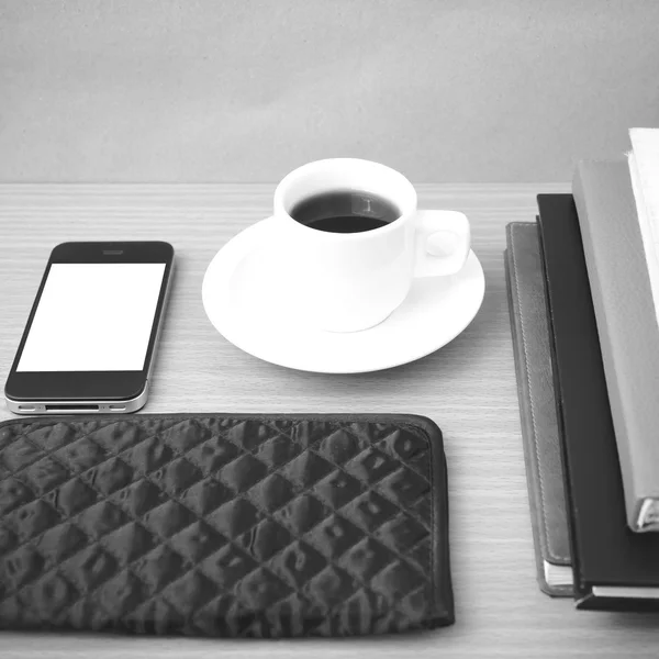 Coffee,phone,stack of book and wallet