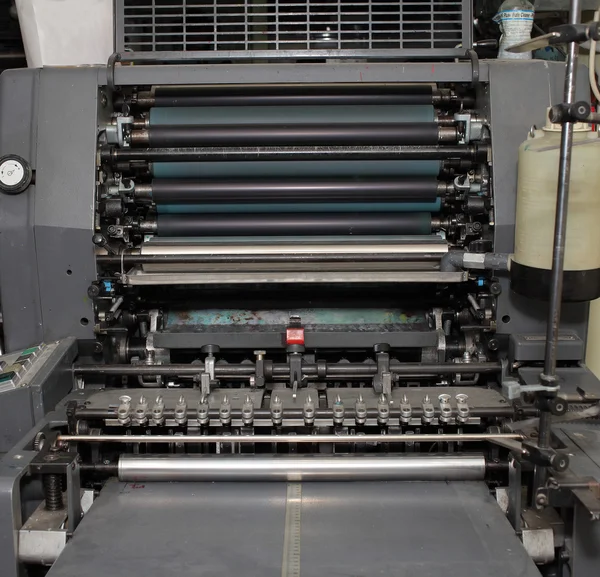 Old offset machine in printing workshop