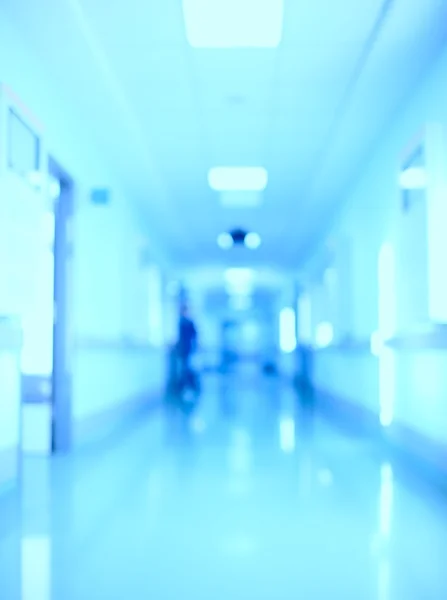 Movement and light in the hospital corridor. Blurred background