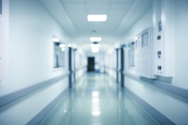 Filled with bright lights hospital corridor, concept of patient`
