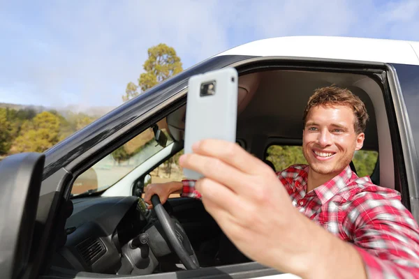 Driver taking photo with smartphone