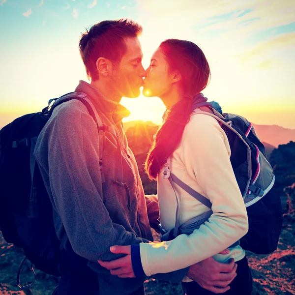 Couple kissing romantic at sunset