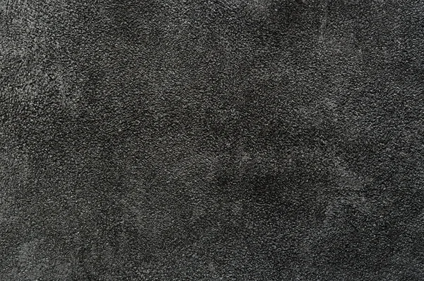 Closeup of dark suede texture