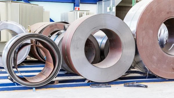 Cold rolled steel coils waiting before feeding to machine