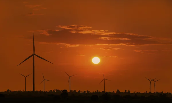 Silhouette wind turbine with sunset