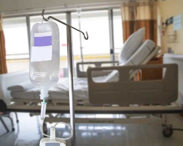 Infusion pump and IV hanging on pole in hospital