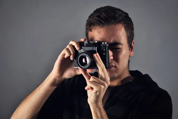 Young photographer with analog camera