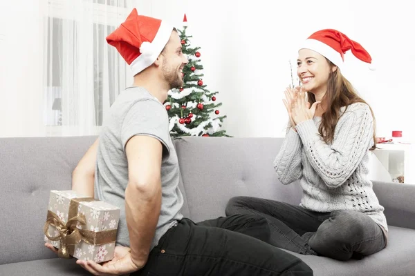 Man surprise girlfriend with christmas gift