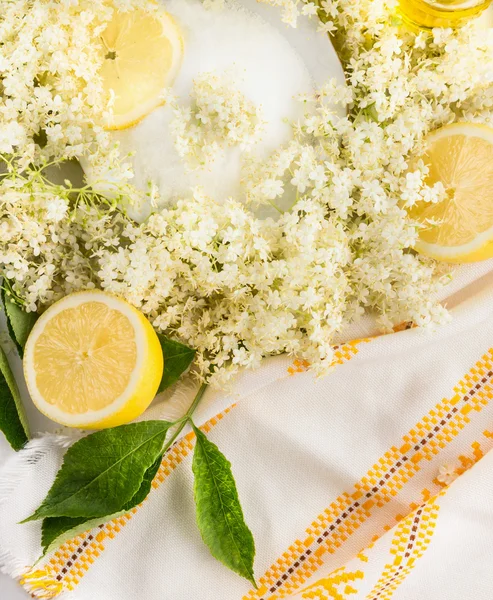 Ingredients for  Elder flowers syrup , sugar and lemons, top view