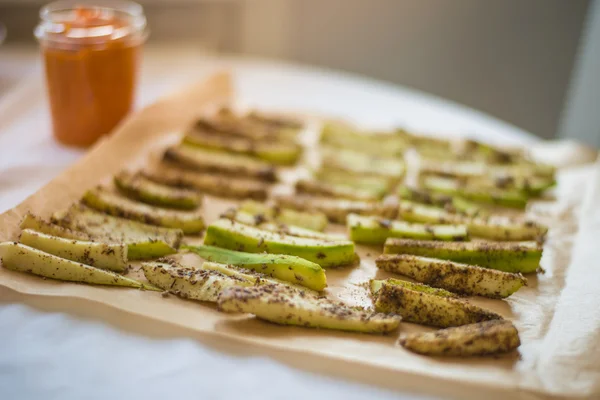 Healthy snacks - zucchini sticks with carrot sause