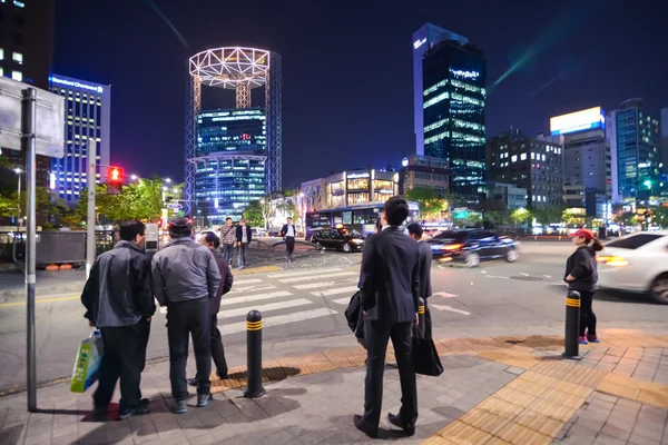 People waiting at the crosswalk in downtown Seoul