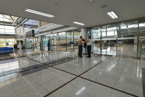 Men are changing clothes in the pavilion at Korean Demilitarized Zone