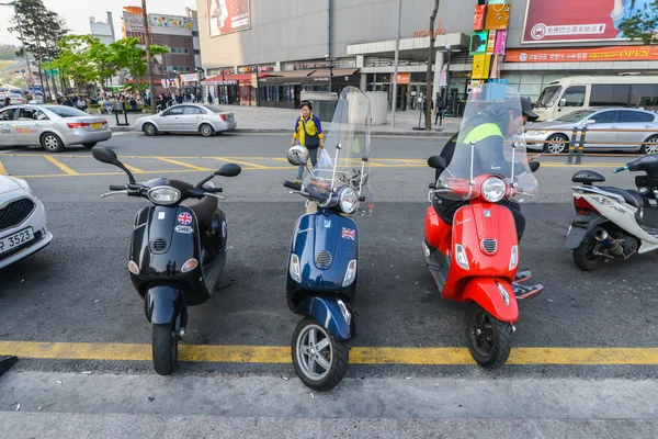 Three similar motorbikes parked parallel at Dongdaemun area in Seoul