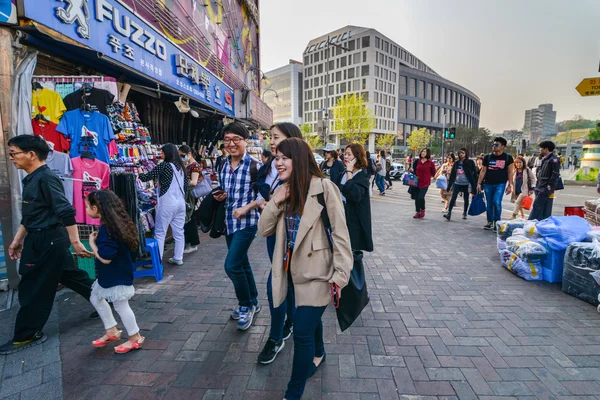 Young people walking at Dongdaemun shopping area in Seoul, Korea