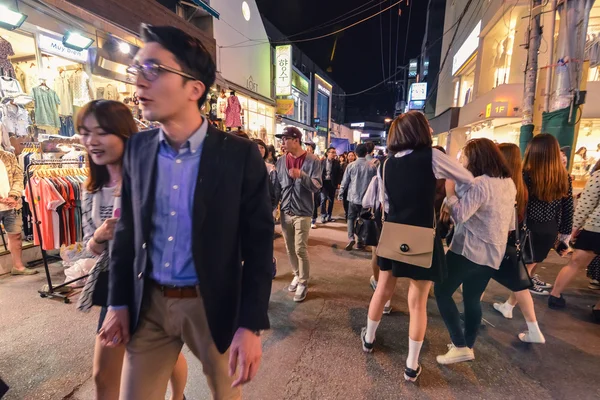Young people walking in evening In Hungdae district in Seoul, Korea