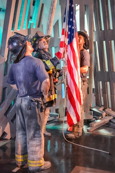 Wax Portraits of Firefighters Raising Flag in Madame Tussaud\'s museum in New York