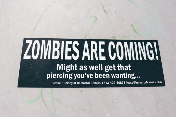 CINCINNATI, OH - CIRCA 2011: black sticker with funny phrase \'Zombies are coming\'  in Clifton neighborhood in Cincinnati, OH, USA at summer 2011.