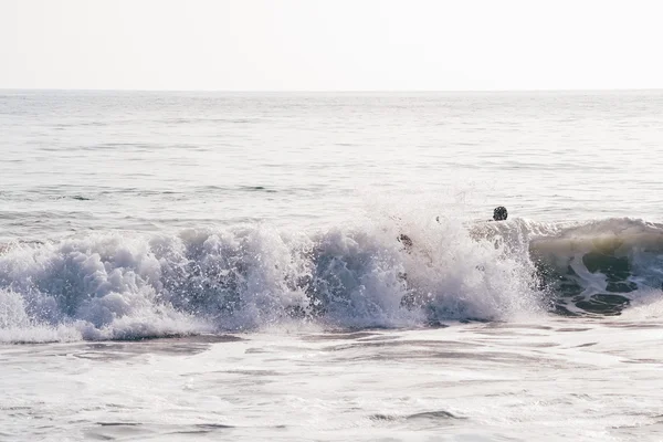 MALIBU, CA - CIRCA 2011: people swim in a sea waves on Malibu beach on a sunny day in California, USA in summer 2011.