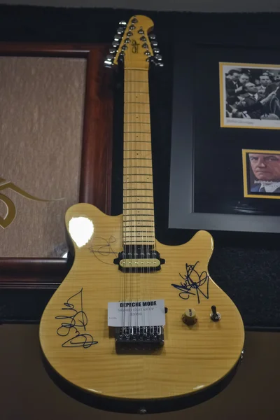 LAS VEGAS - CIRCA 2011: yellow famous electric guitar with autograph in a shop at Las Vegas Strip at night time circa summer 2011 in Las Vegas, Nevada, USA.