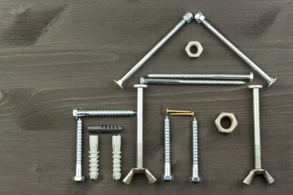 Building a house for the family. Needed for building. Building components. Screws and tools for building. Planning for the construction of the house. Model House of components.