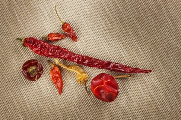 Different kinds of dried chili peppers. Dried red chili peppers. Hot spices to food.